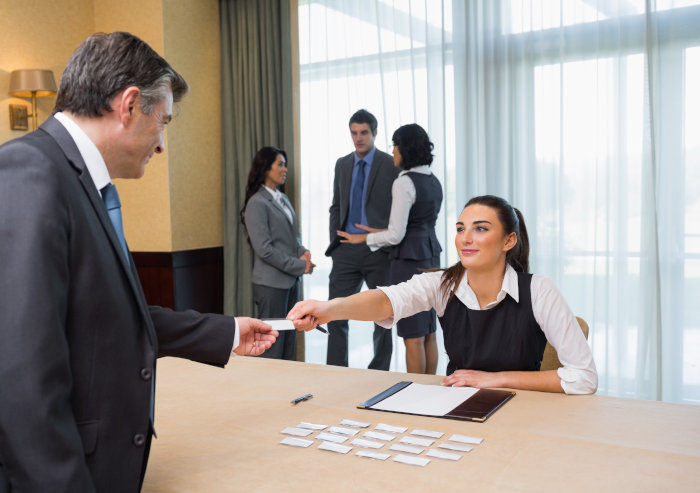Assistant On-Site Manager Page Assistant On-Site Manager at a registration table